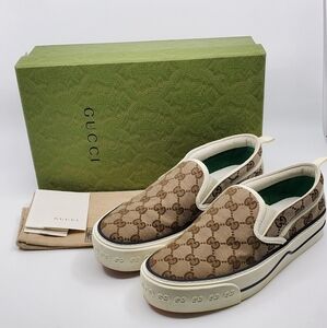 Gucci Tennis Slip On GG Canvas Sneakers.